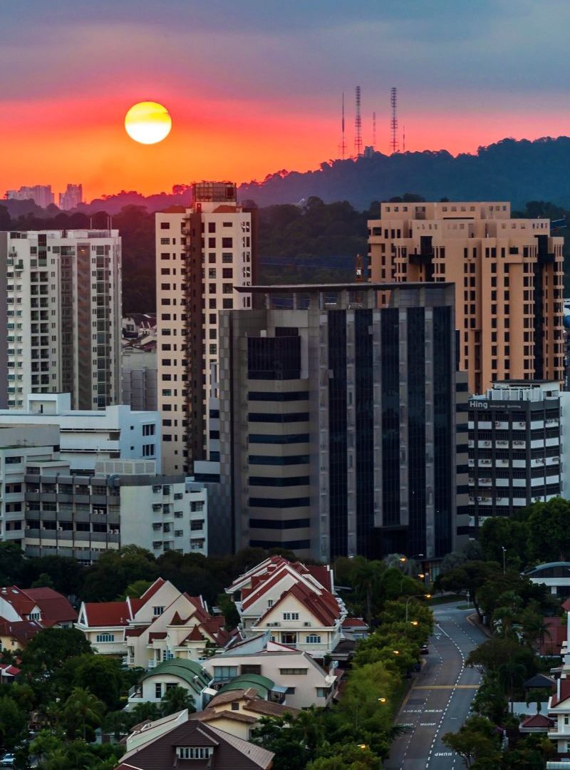 the-sun-setting-behind-bukit-timah-hill-in-singapo-2024-12-01-17-22-40-utc