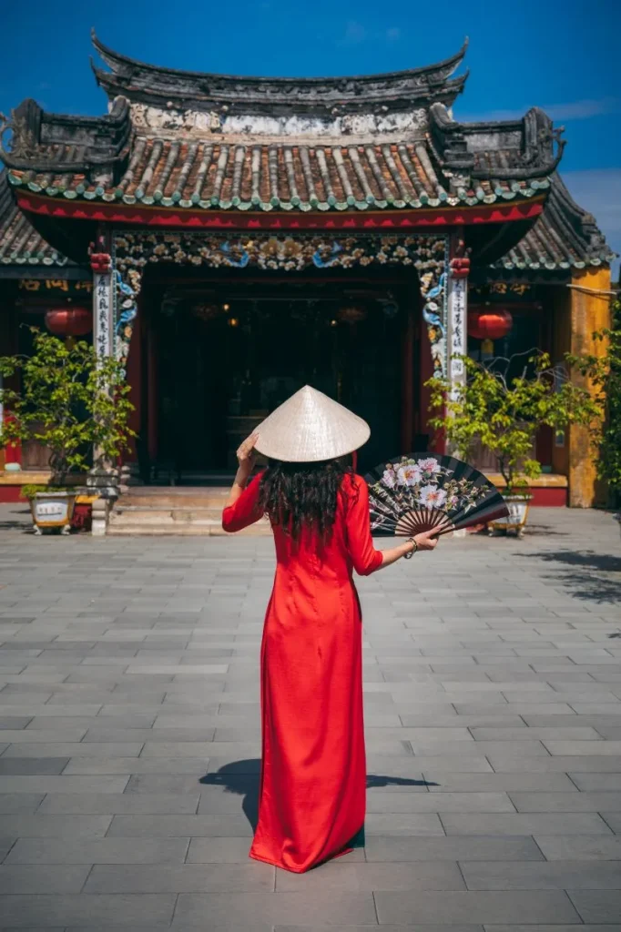 a-woman-in-a-traditional-vietnamese-dress-on-the-b-2026-03-16-22-59-14-utc