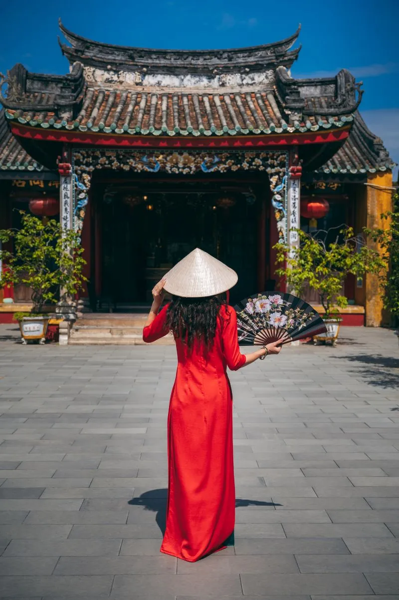 a-woman-in-a-traditional-vietnamese-dress-on-the-b-2026-03-16-22-59-14-utc