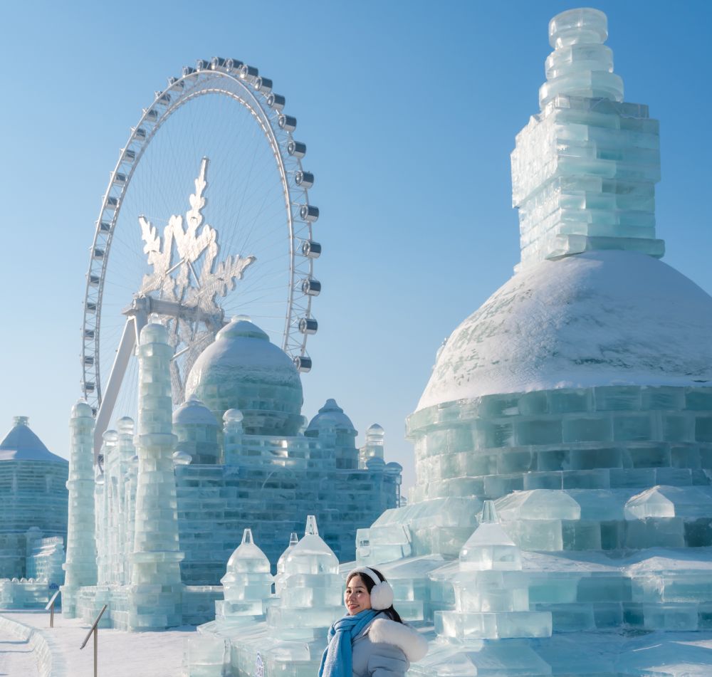 young-happy-female-tourist-enjoying-at-ice-and-sno-2026-03-26-10-27-06-utc