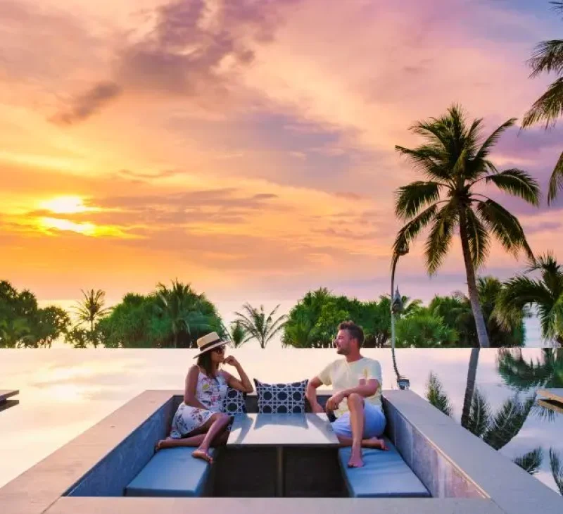 couple-watching-sunset-in-infinity-pool-on-a-luxury (1)
