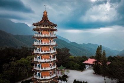 pagoda-stands-amidst-taiwan-mountains-under-an-ove-2025-05-16-05-12-50